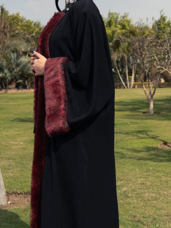 Black crepe kaftan with burgundy fur details on the sleeves and front for a bold and luxurious touch. - Image 3